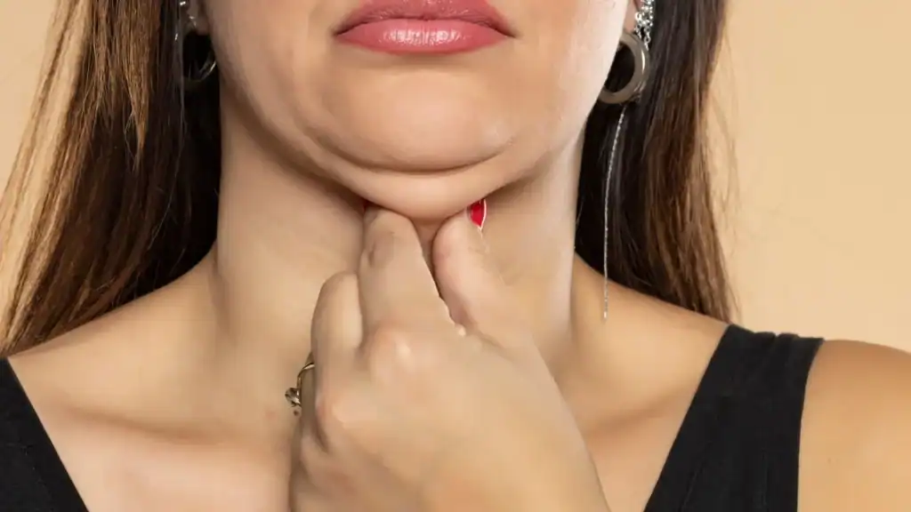 An image of a woman with double chin, sad, worried : Non Surgical Double Chin Removal Treatment in Salford Priors, UK